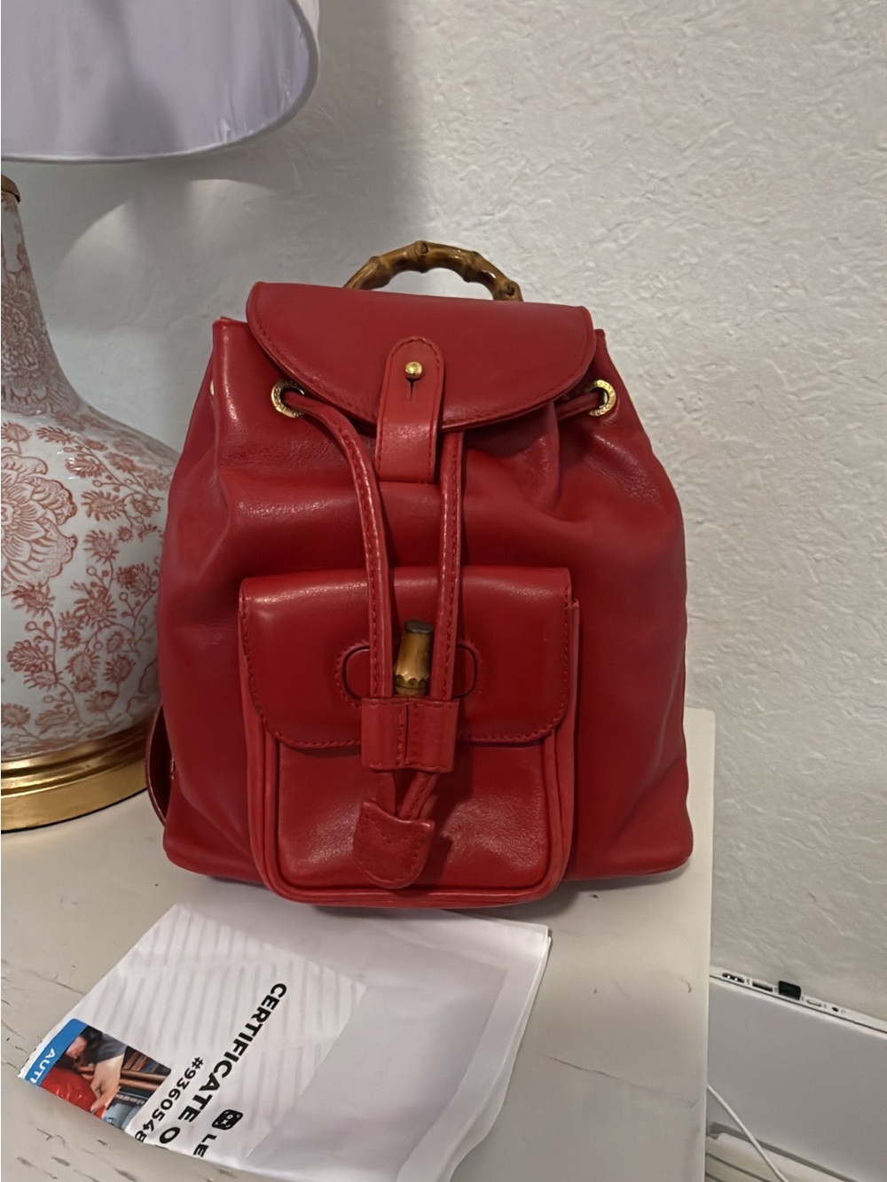 Vintage GUCCI red leather backpack with bamboo handle